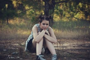 Image of lady sitting on ground contemplating Body Diversity